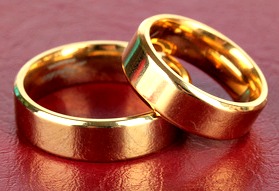 Wedding rings on red background